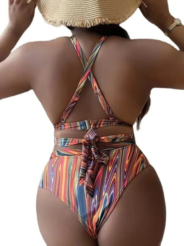 Women's floral print high-waisted bikini swimsuit with split sides.