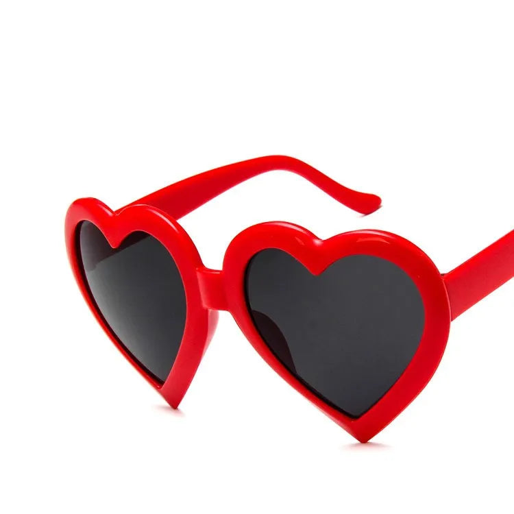 Children's heart-shaped sunglasses with bright red resin lenses and full rim frame