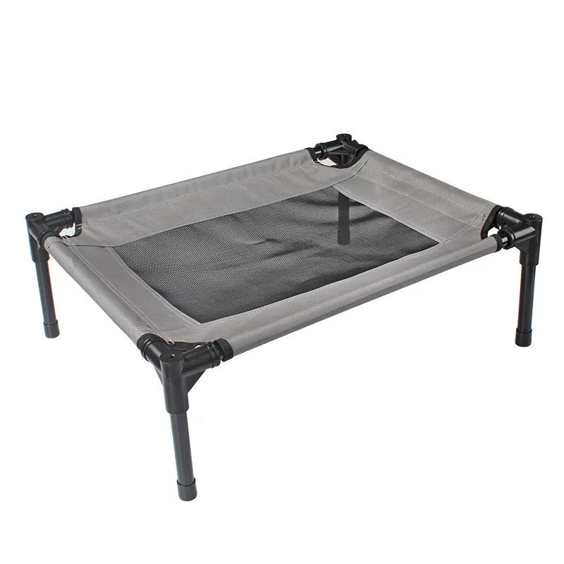 Black portable outdoor dog bed with steel frame and removable Oxford cloth cover, shown on grass.