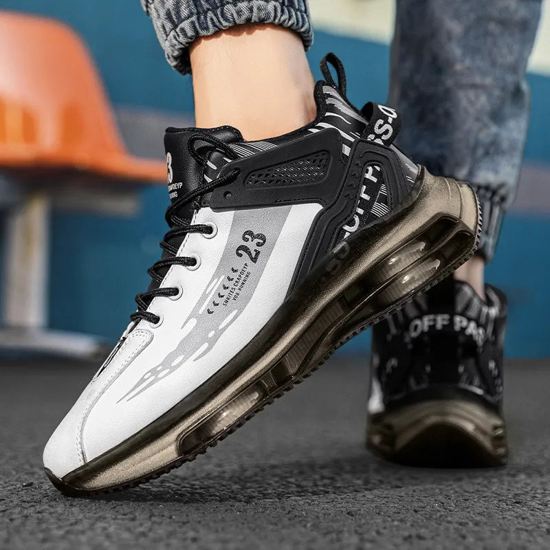 Men mesh breathable cushioning running sneakers in black gold, side view with thick sole and front tie closure