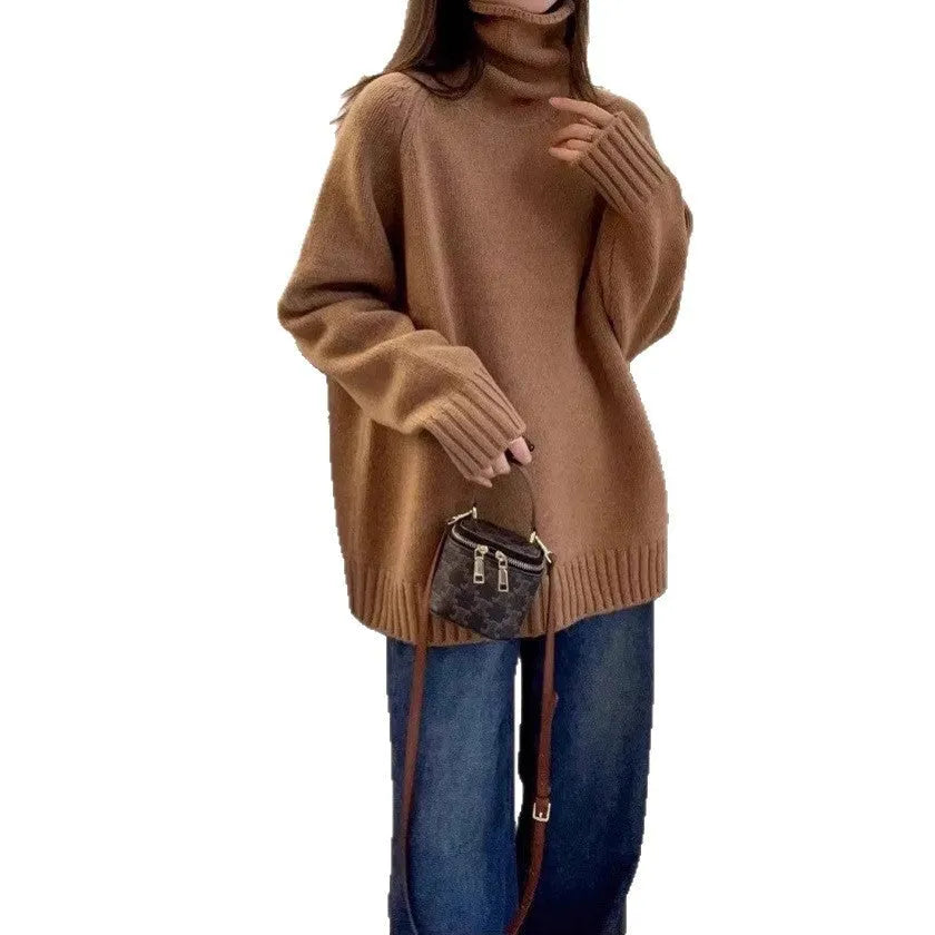 Women's loose thick grey turtleneck sweater with curling pile collar, casual pullover style.