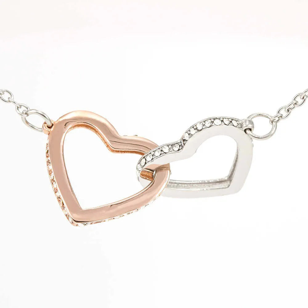 Double heart copper pendant with two-colour peach finish on white background