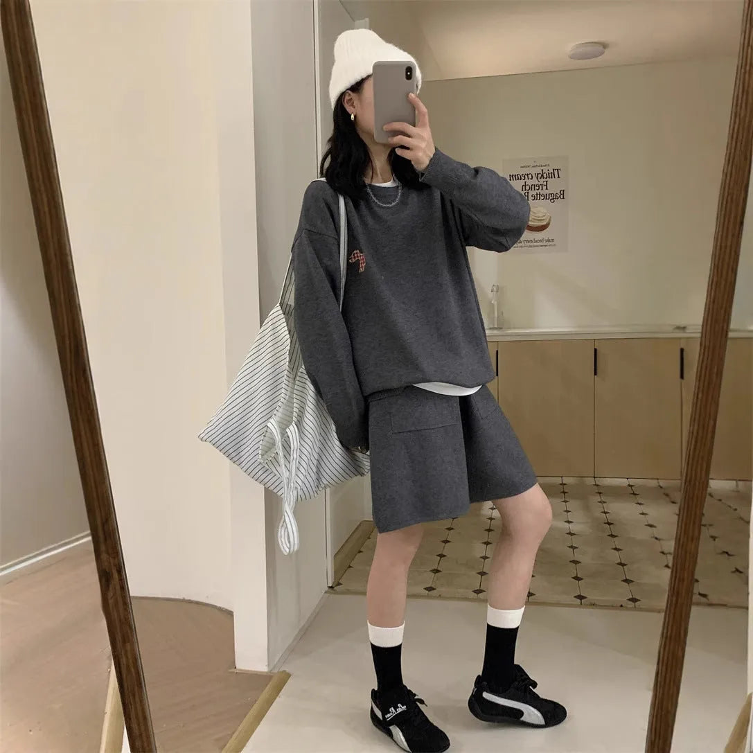 Women's knitted sweater and shorts suit in imitation cashmere with animal embroidery, shown in milk blue.