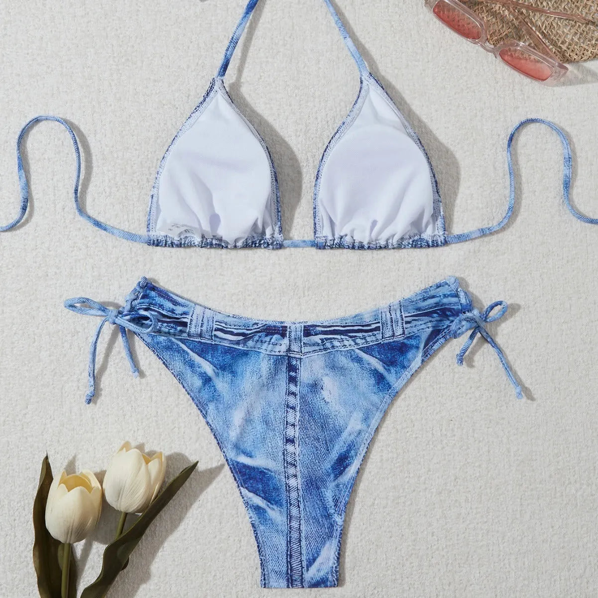 Denim blue printed bikini set with criss-cross straps on the top.