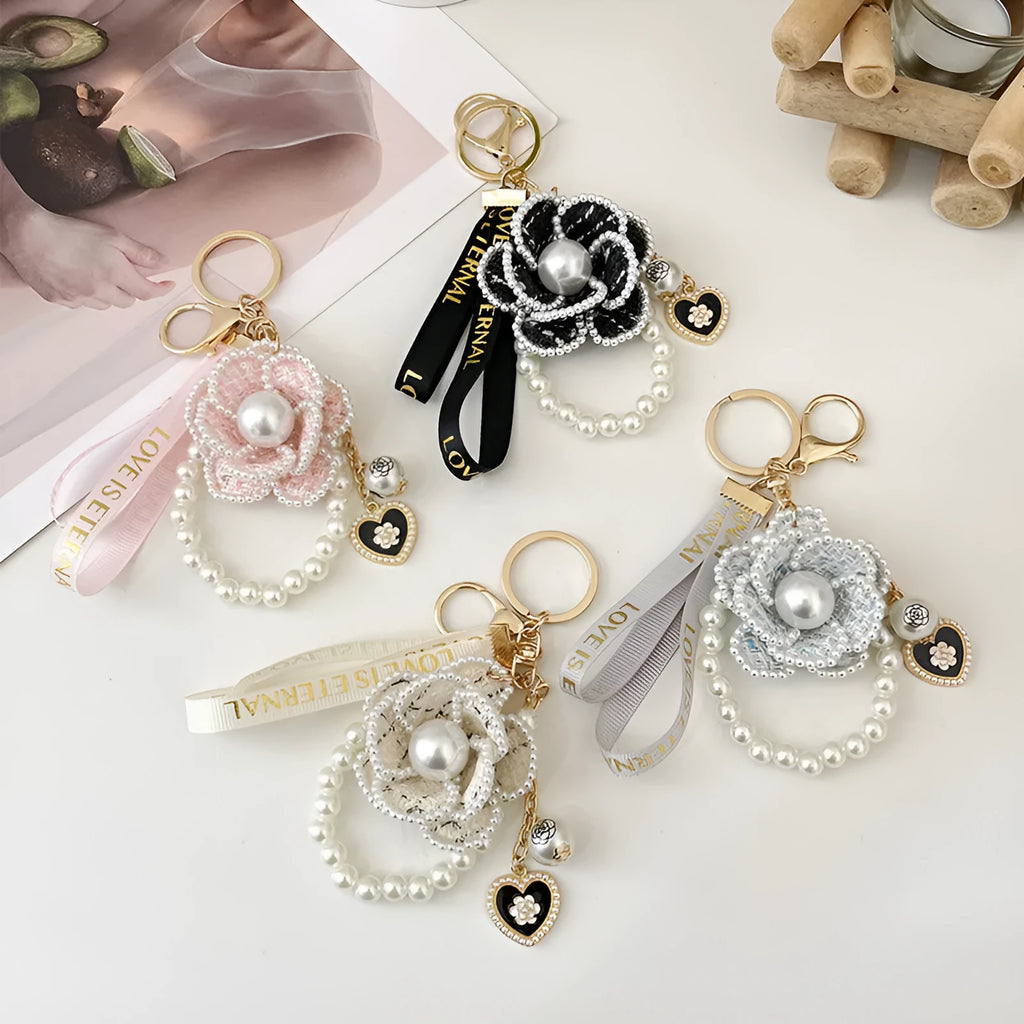 Camellia key chain with ribbon and pearl accent in Korean style, available in four colours