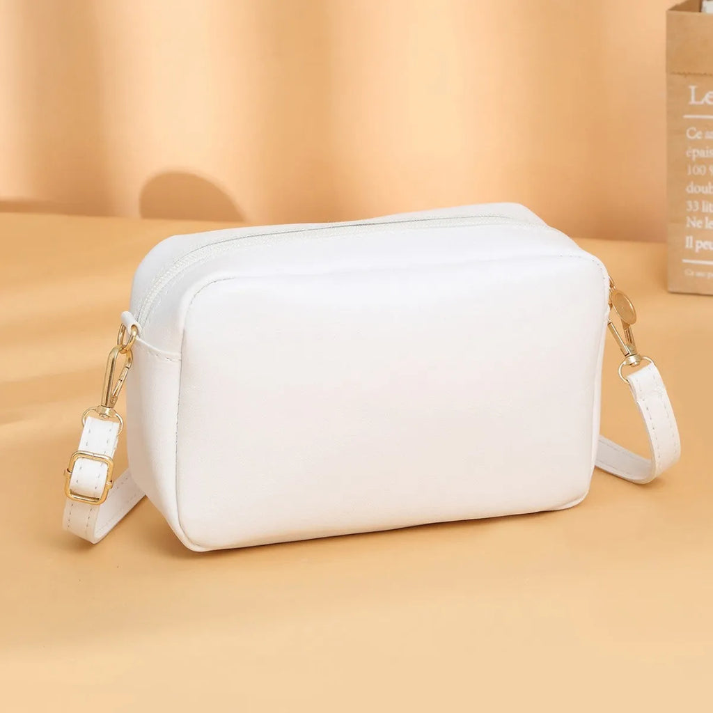 PU ladies' shoulder bag in solid colour with three-dimensional pocket and urban simplicity design