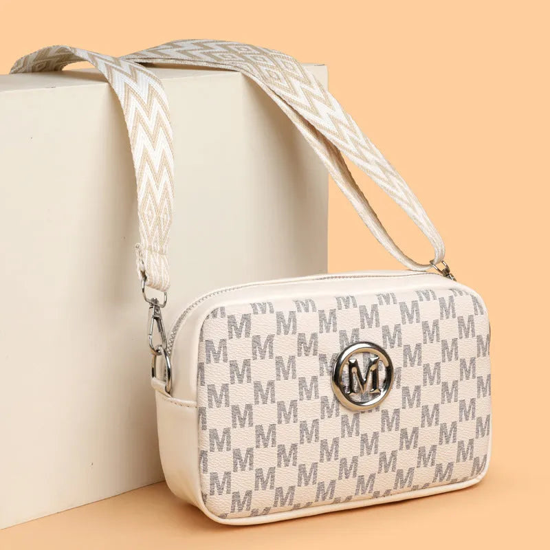 Women's synthetic leather crossbody bag with wide shoulder strap and three-dimensional front pocket