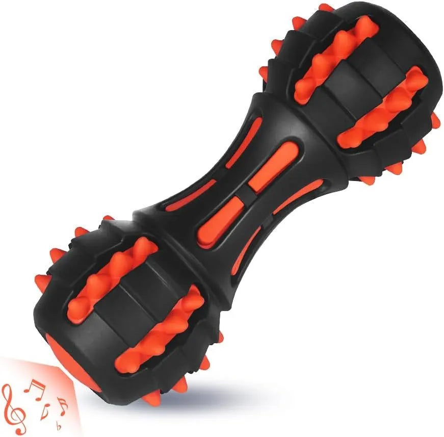 Red dumbbell-shaped durable rubber dog toy with squeaker for aggressive chewers.