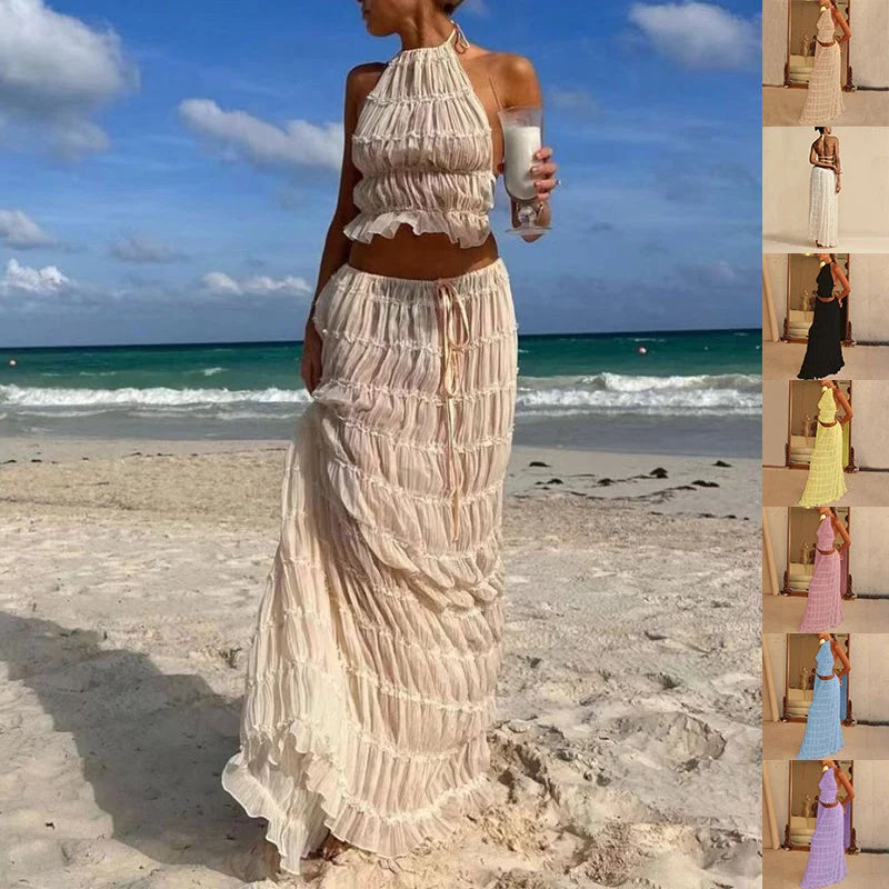 Stylish women's beach dress suit featuring a halter top and pleated skirt, perfect for summer outings.