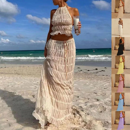 Stylish women's beach dress suit featuring a halter top and pleated skirt, perfect for summer outings.