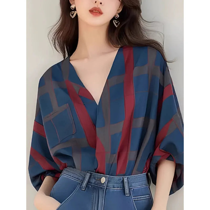 Women's loose-fit pullover top with painted pattern, short length, and drop-shoulder sleeves in polyester