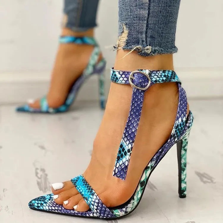 Blue women's high heel shoe with buckle closure, pointed toe, and hollow-out detail on artificial PU leather.