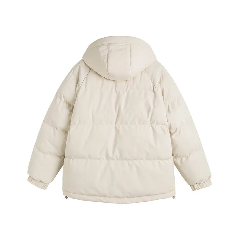 Loose beige winter cotton-padded coat with side pockets on a hanger