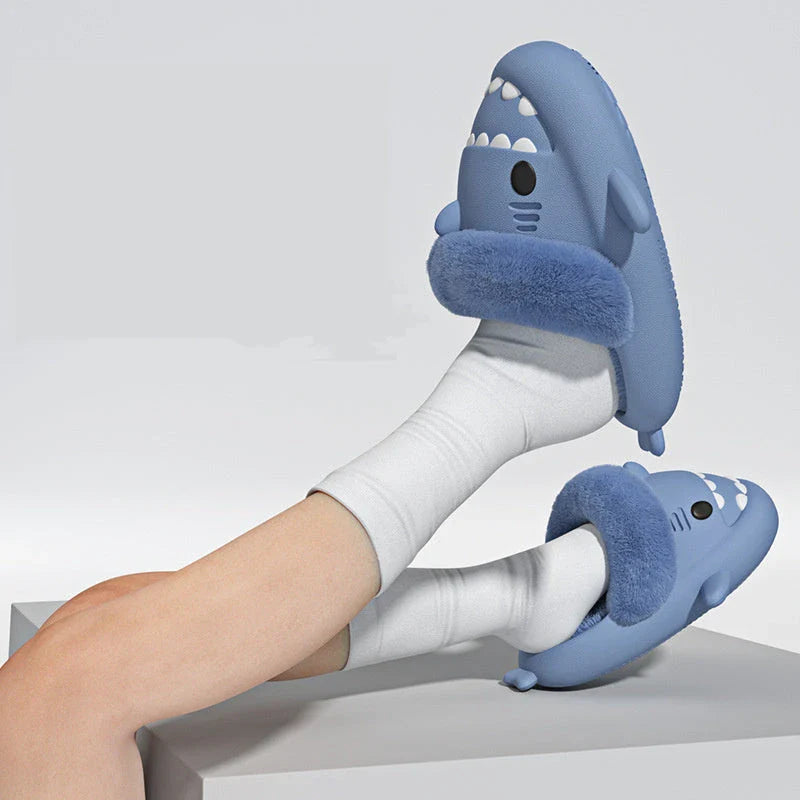 Cozy shark-inspired slippers in various colors, featuring plush, fuzzy material and durable non-slip soles