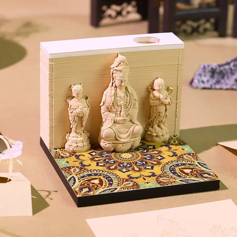 3D paper carving calendar 2026 showing Guanyin Bodhisattva and Sends Wealth Boy in seated lotus design, retro style