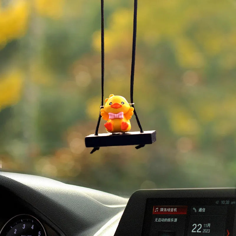 Yellow plastic duck doll car hanging ornament with four design variations for vehicle interior decoration