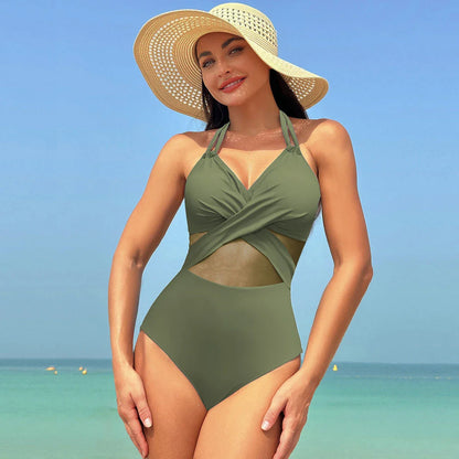 Stylish one-piece swimsuit with cross-strap design and mesh panels, available in a variety of vibrant colors