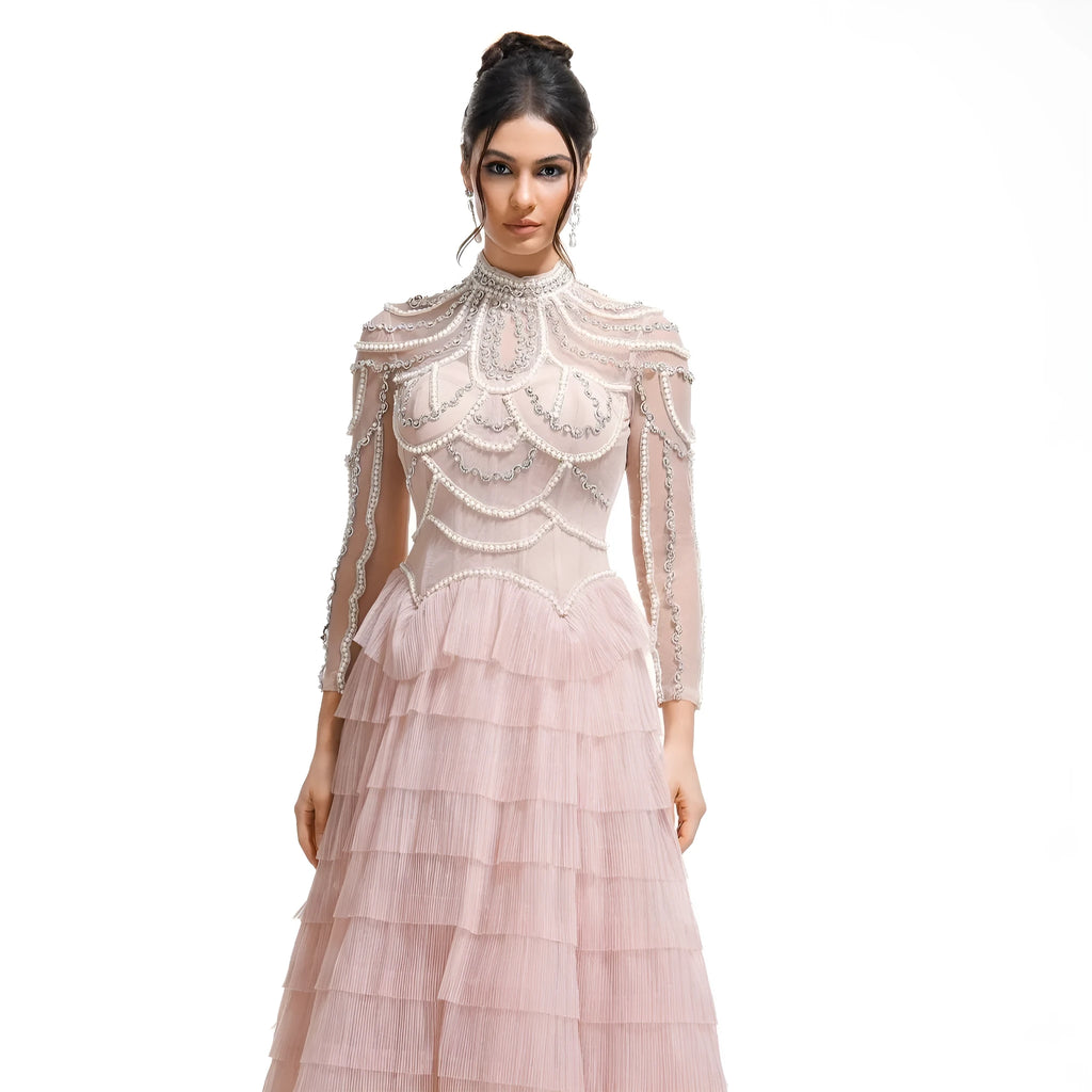 Women's long sleeve black beaded dress with three-dimensional decoration and mid-waist.