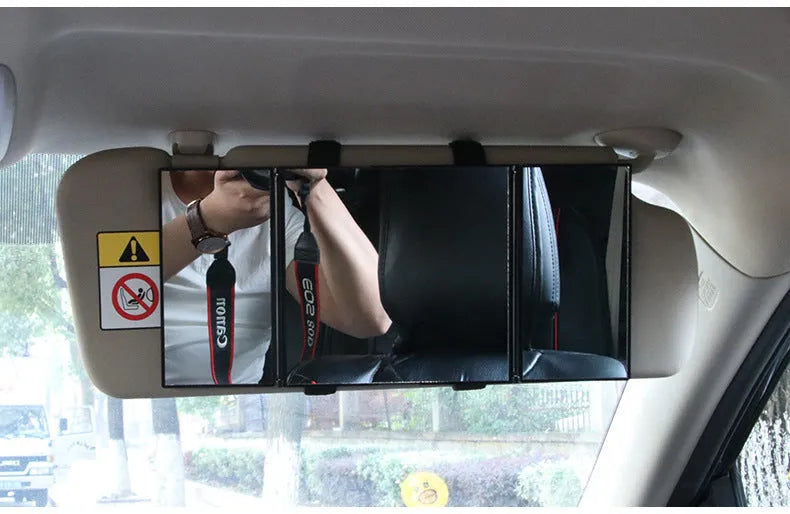 Silver car folding grooming mirror shown opened and closed on a car dashboard.