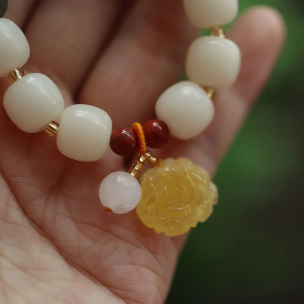 Natural bodhi root bracelet with 10mm beads in gradient white jade colour and lotus pendant
