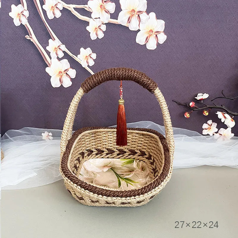 Coffee brown straw basket with hand-woven hemp rope detailing, shown on a wooden table.