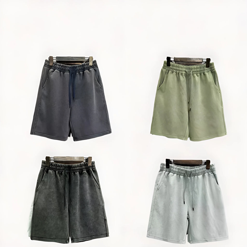 Man wearing navy blue distressed-style casual cotton shorts with a loose straight leg fit.