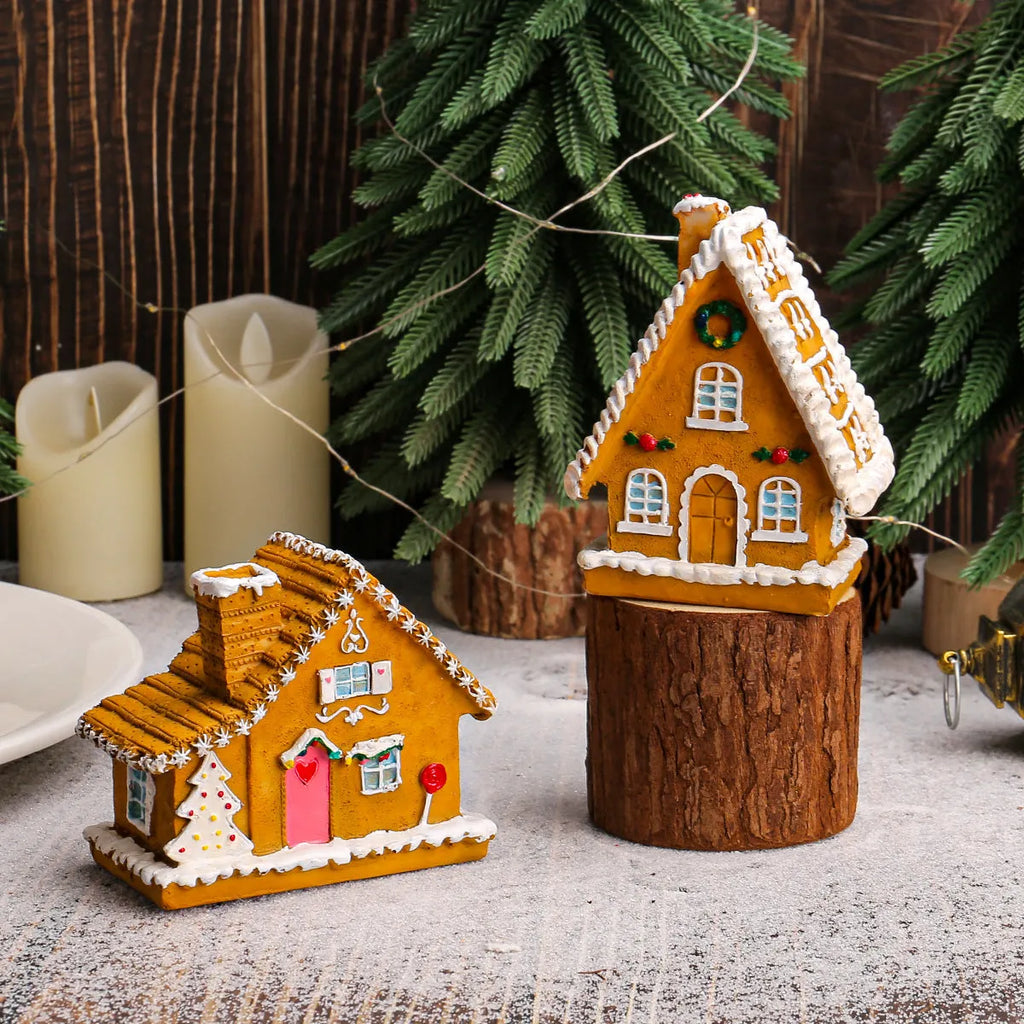Christmas resin small house micro landscape with warm LED glow on tabletop