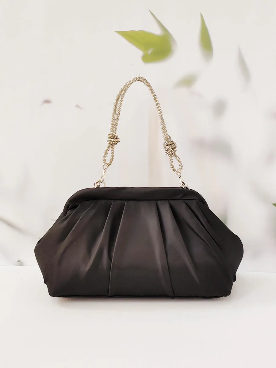 Soft polyester women's dinner messenger bag in shell shape with diamond pattern, shown in lavender purple.