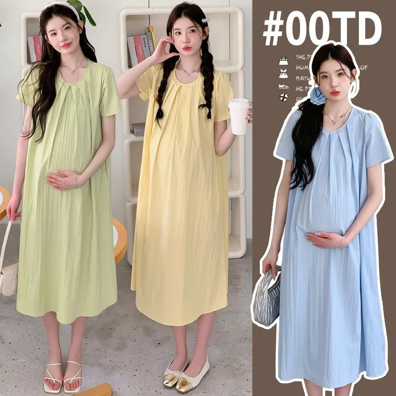 Loose summer maternity dress in sky blue with petal sleeves and nine-quarter length sleeves, street fashion style