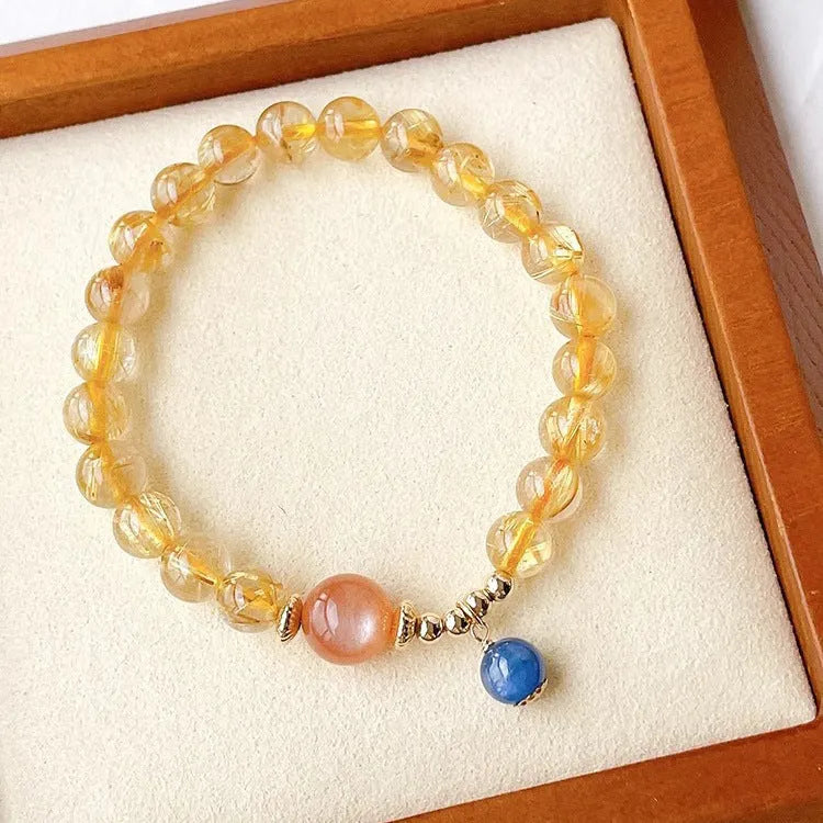Gold rutilated quartz and sunstone bracelet with round diamond-cut beads for women