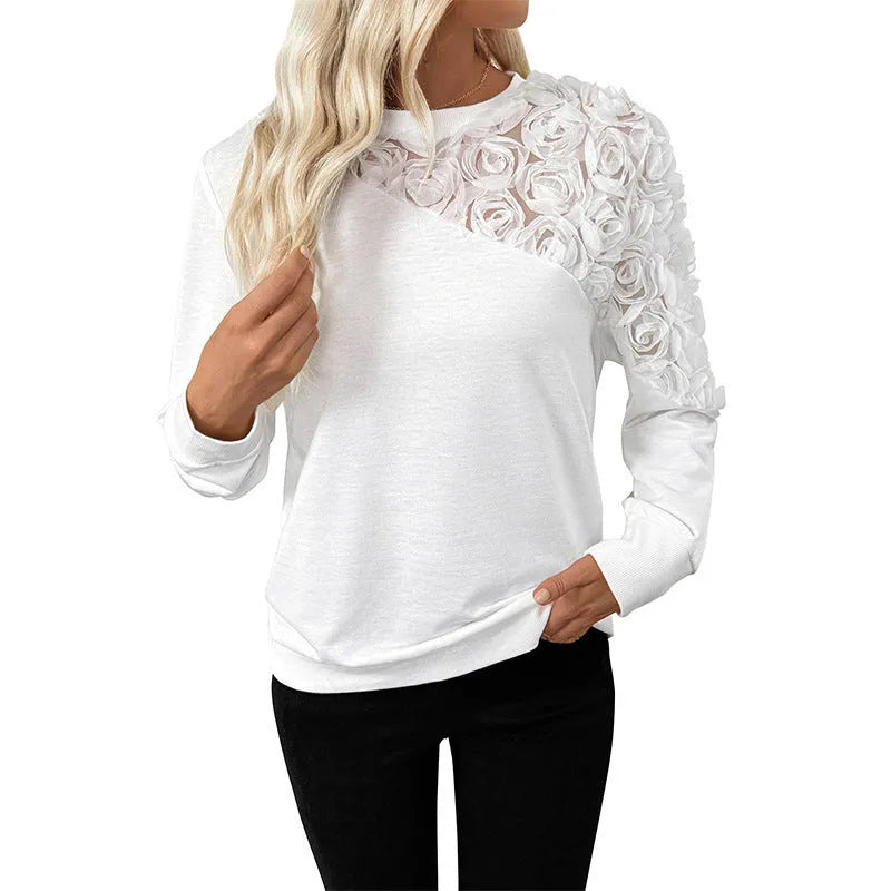 White long sleeve loose pullover top with a floral pattern.