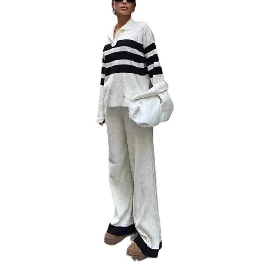 Women's black and white striped knitted polo shirt with matching trousers, a casual two-piece set.