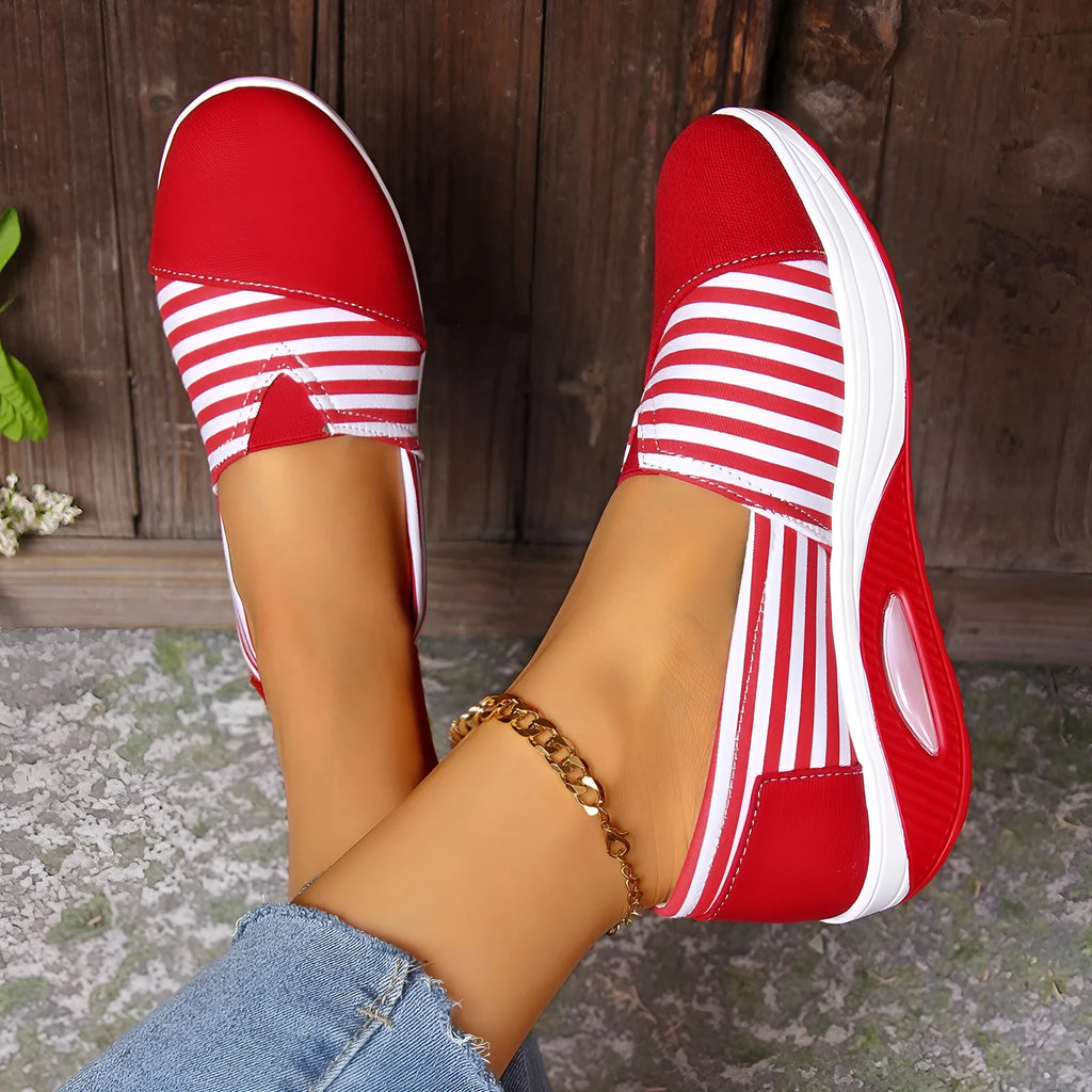 Striped canvas casual women's shoes with round head, low-top upper, and flat platform heel in blue and red.