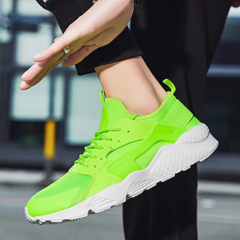 Men's fluorescent red mesh low top casual shoes with cross strap and white lace-up front on a flat MD sole.