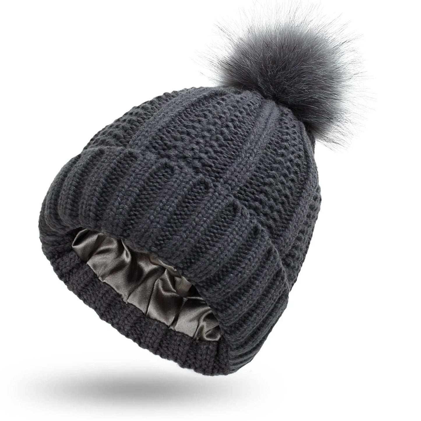 Cozy satin-lined knit beanies with pom poms in various colors for women's winter fashion