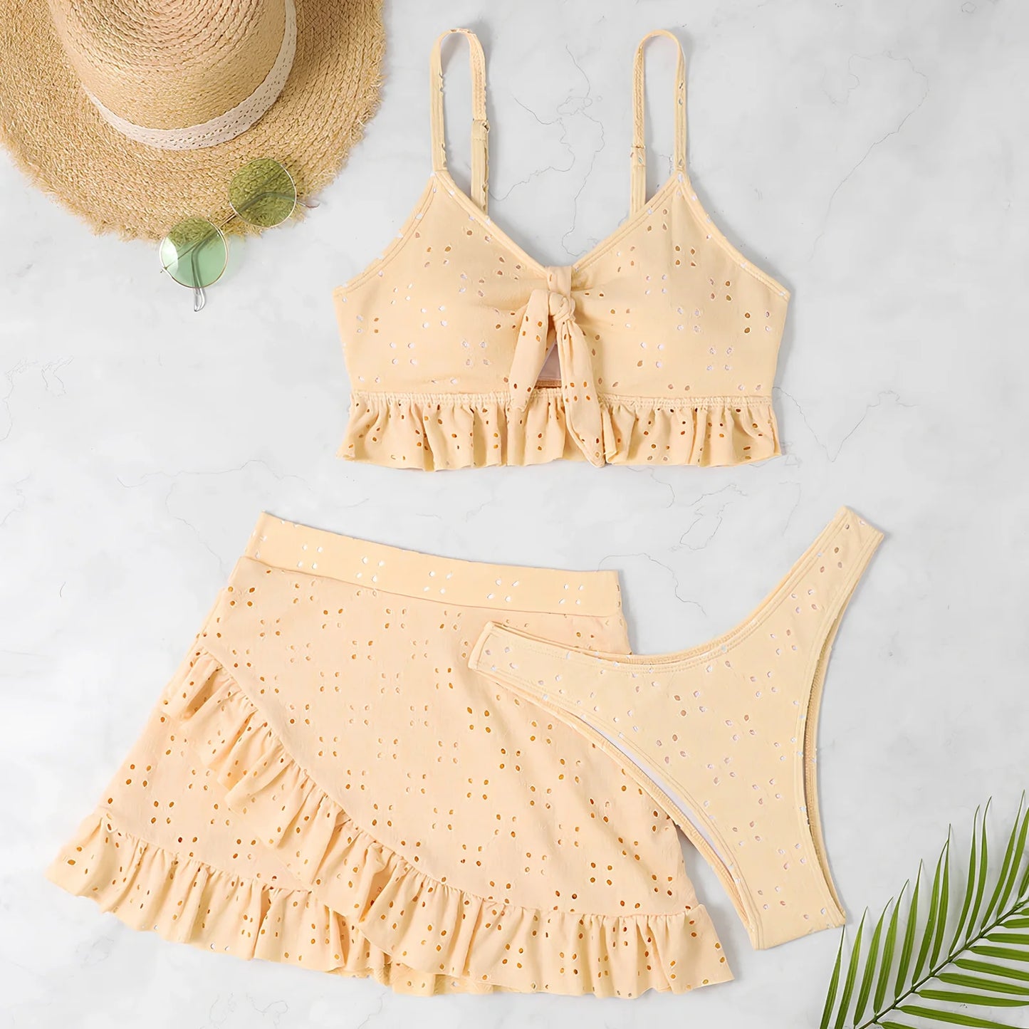 Women's 3-piece bikini set with hip-hugging skirt and ruffle detailing in polyester swimwear