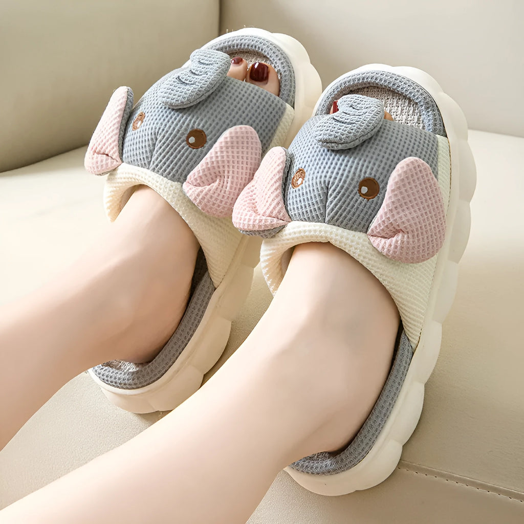 Elephant grey open-toe linen slippers for couples on a plain background.