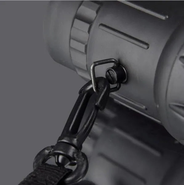 Black 16x52 monocular with large objective lens, shown with focus wheel and BAK4 roof prism optical design.