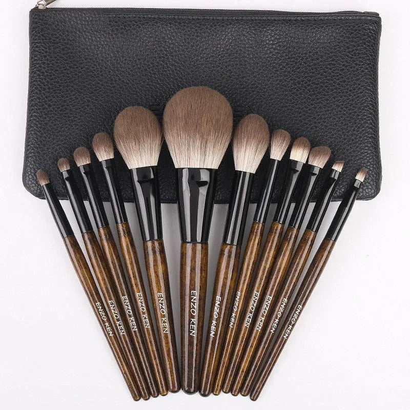 12-piece wooden handle makeup brush set with a powder brush in a grey PU pouch