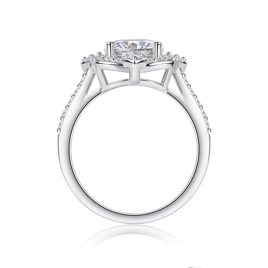 Egg-shaped moissanite ring set with S925 silver and platinum plating on a white surface