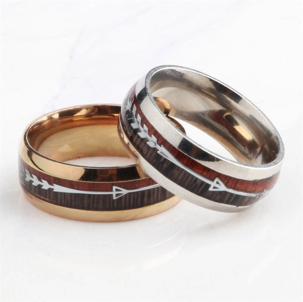 Men's stainless steel ring with wood grain arrow inlay in black, rose gold, and silver