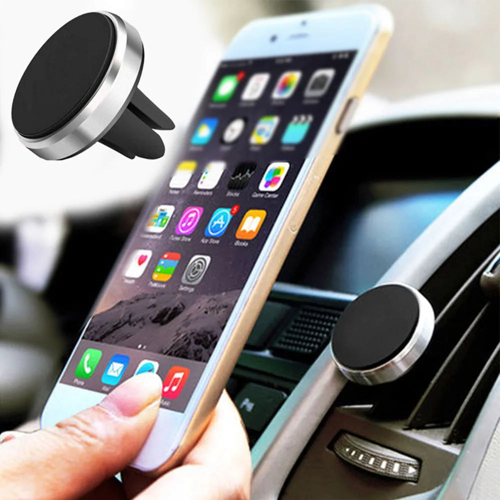 Rotating car magnetic phone holder in black on a dashboard air vent with a smartphone attached