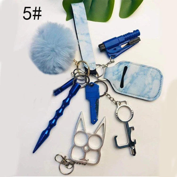 Self-defense keychain set for women with 11 safety tools including alarm, window breaker, and whistle
