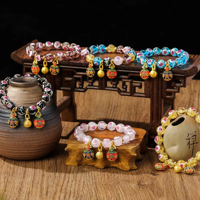 Handmade glass bracelet with swallowing gold beast design and 10mm heart-shaped beads in fluorescent glaze