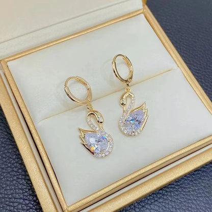 Sweet Rhinestone Swan Earrings in gold, green, and suit colours, showcasing unique design and sparkle.