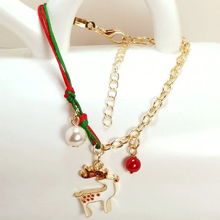 Christmas charm bracelet with snowman, Santa Claus, and snowflake designs