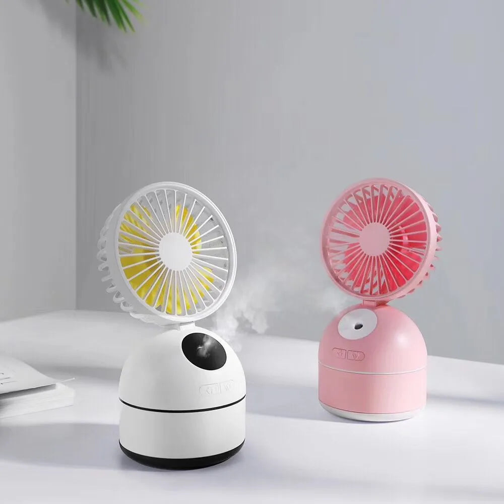 Portable USB fan humidifier in white with cool mist output and integrated fan, placed on a desk