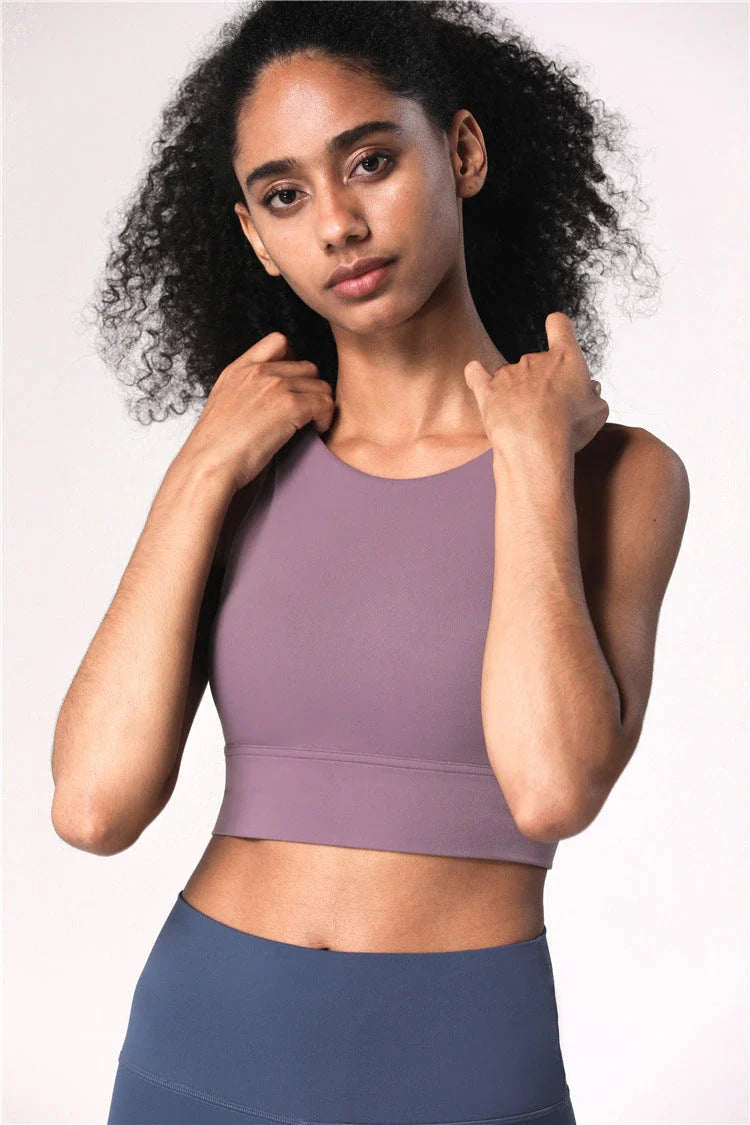 Premium cross-back sports bras with supportive longline design in various colors and sizes