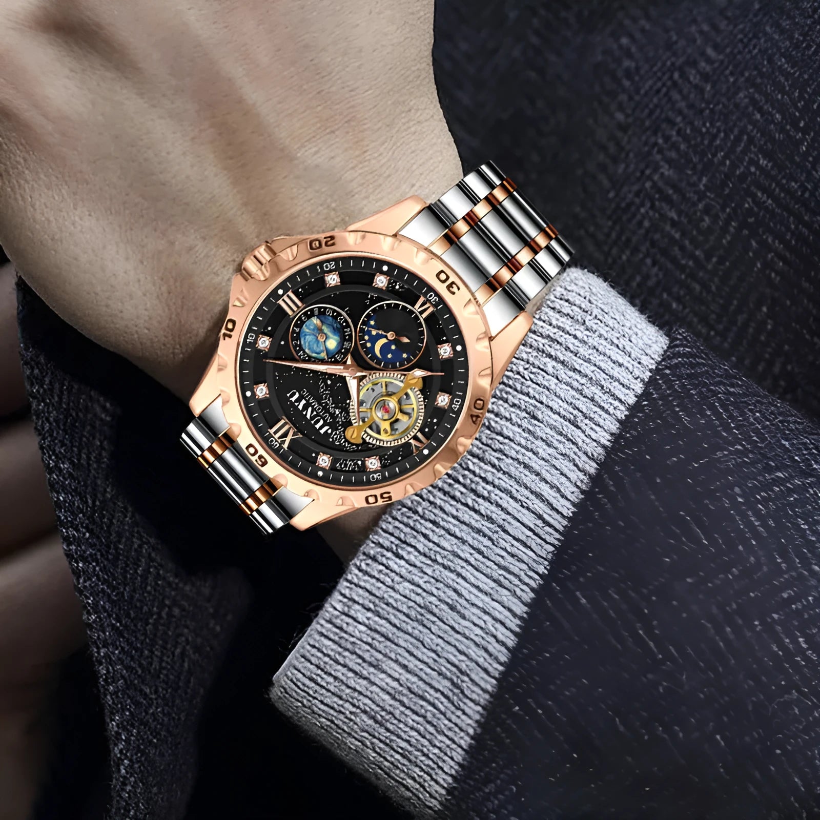Men's waterproof luminous automatic mechanical watch on wrist, showing rose gold case with starry sky black dial.