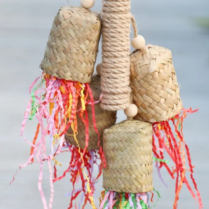 Colourful shredded paper parrot biting toy with wood beads and sisal rope, measuring 15 by 35 cm